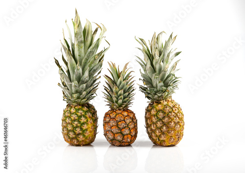 Three beautiful pineapples on white background