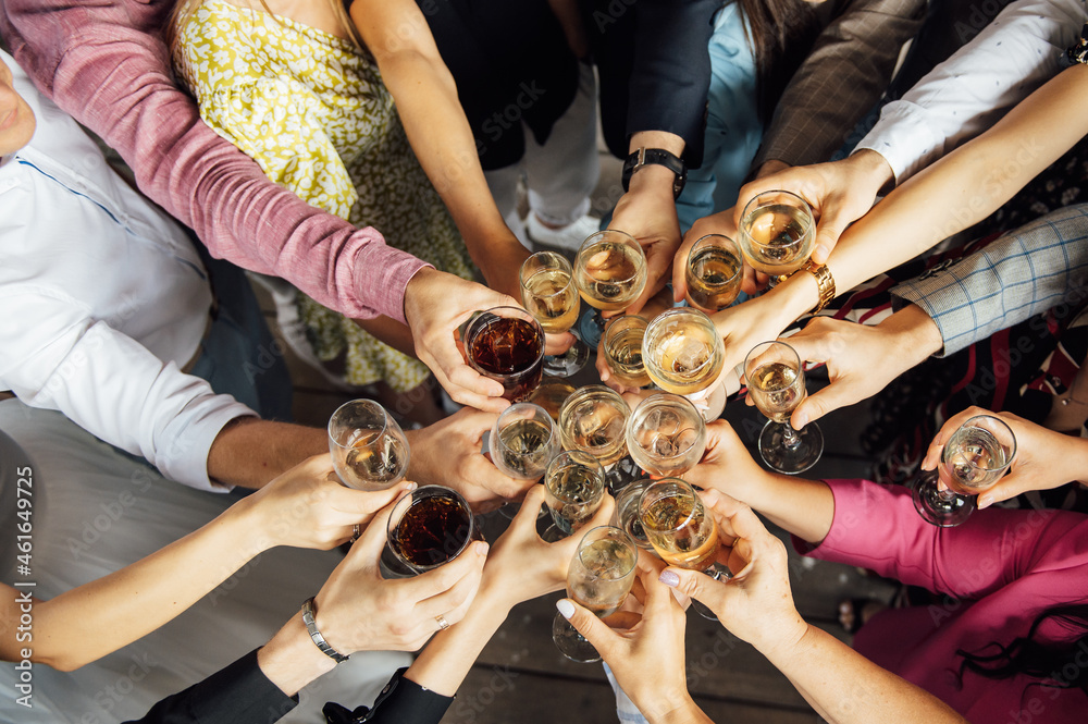 Fototapeta premium People hold in hands glasses with white wine. wedding party.
