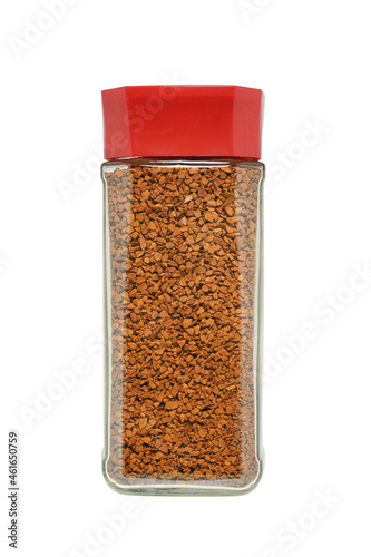 A transparent glass jar filled with soluble, freeze-dried granules of strong, aromatic coffee. Closed with a plastic lid on a white background.