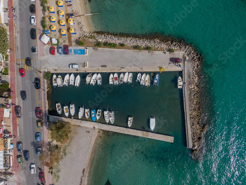 Aerial top down view of ipsos beach in Greece. . Beautiful torquoise water and beach with umbrellas © ernestos