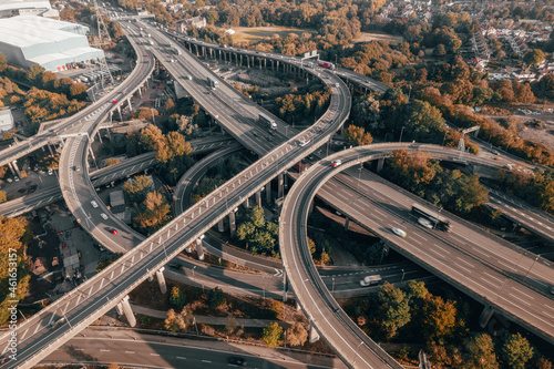 Vehicles Driving on a Spaghetti Junction Interchange in the UK at Sunset Fototapet
