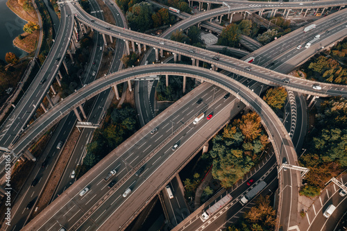 Vehicles in the UK Driving on a Spaghetti Junction Interchange At Sunset