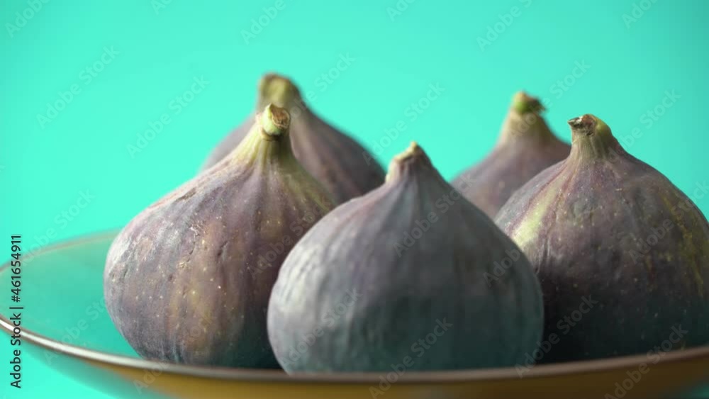 Fresh figs rotate in front of the camera. Healthy dietary product close-up. Fresh figs rotate in front of the camera. Healthy dietary product close-up.