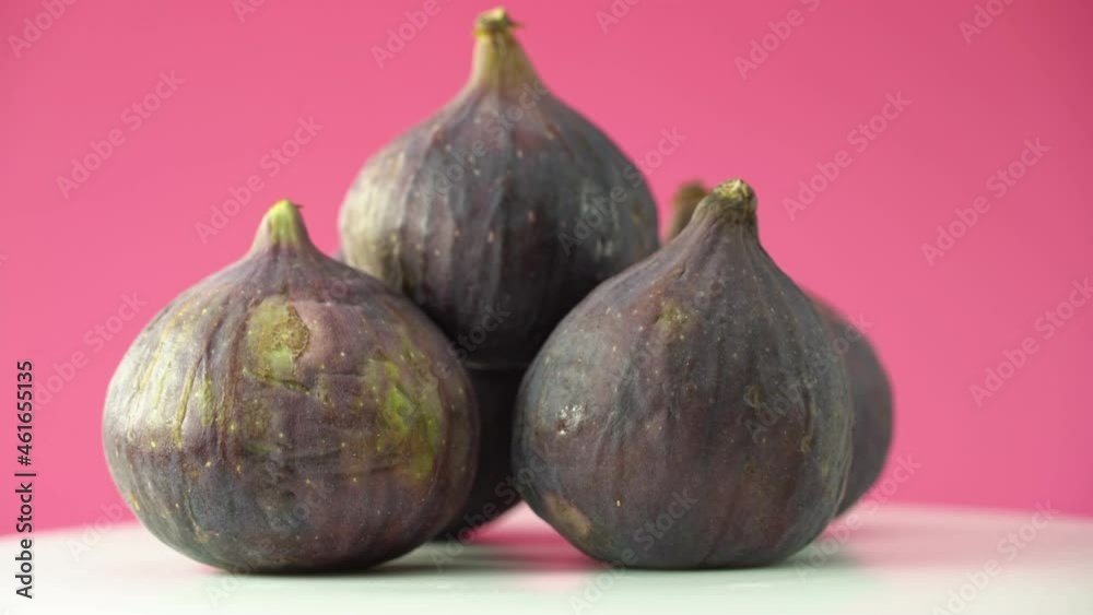Fresh figs rotate in front of the camera. Healthy dietary product close-up. Fresh figs rotate in front of the camera. Healthy dietary product close-up.