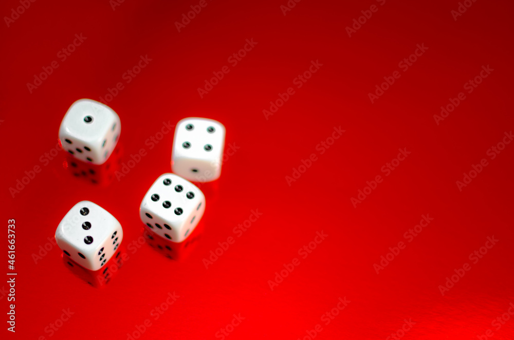 Group of white dice reflected in red background Group of white dice reflected in red background