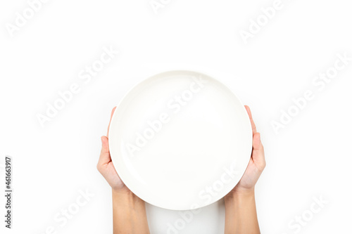 Fototapeta Hands holding a dish ceramic isolated on white background
