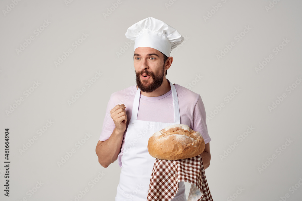 male baker with fresh bread in his hands cooking baking male baker with fresh bread in his hands cooking baking