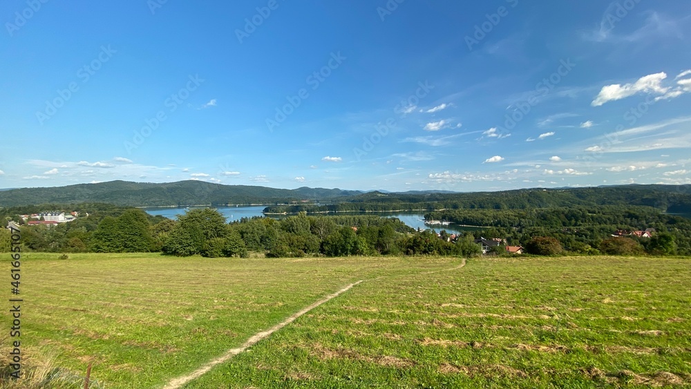 Lake Solinskie on a sunny day blue sky in the distance of the Bieszczady Mountains