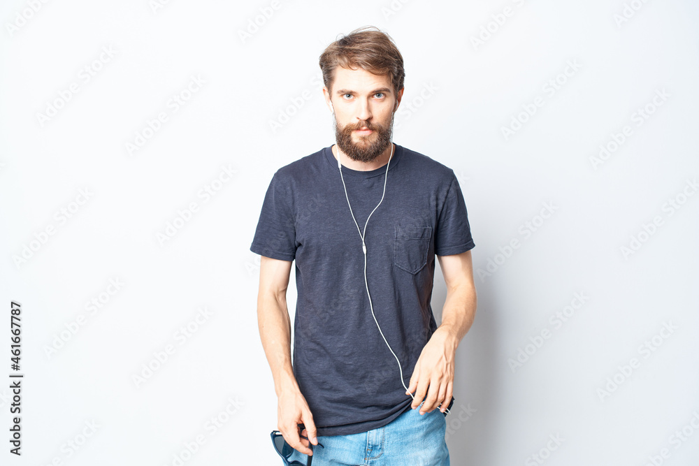 Fototapeta premium bearded man headphones sunglasses music dance fun light background
