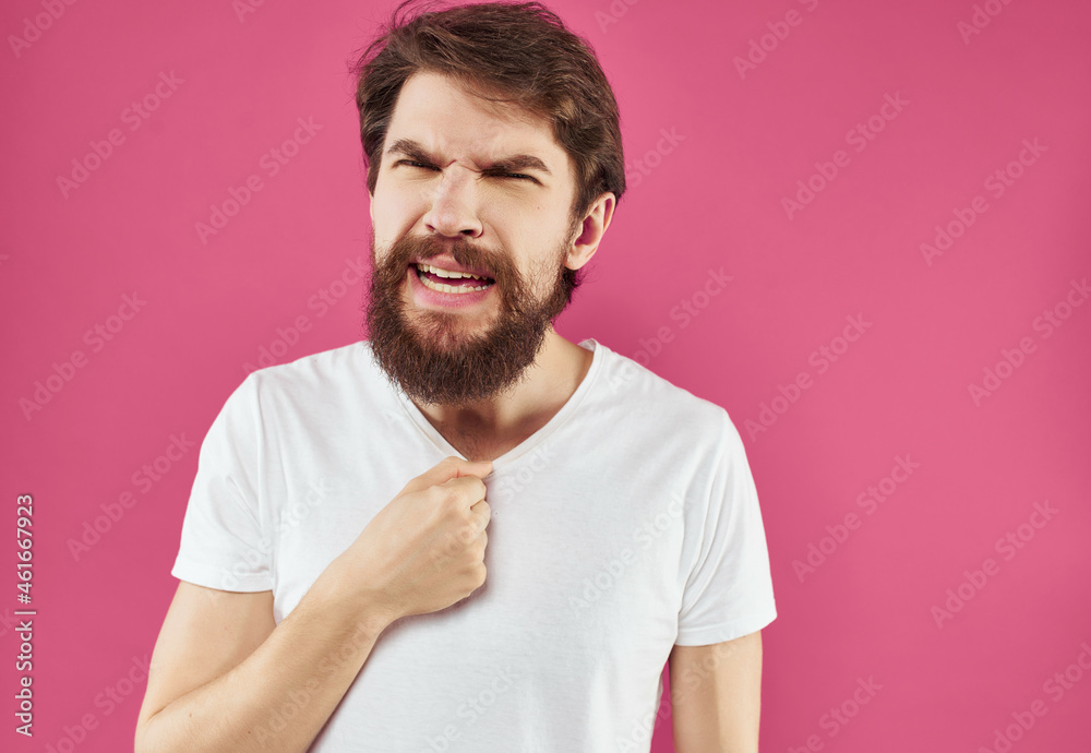 emotional man in a white t-shirt surprised look close-up emotional man in a white t-shirt surprised look close-up