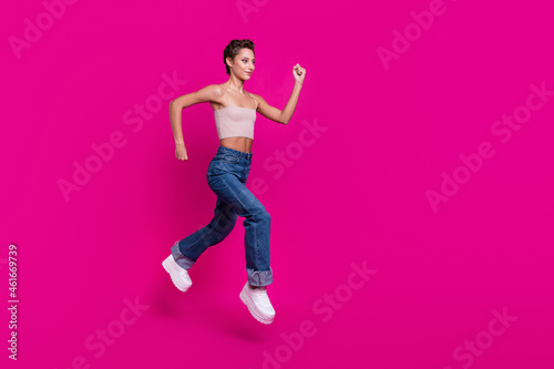 Full size profile side photo of charming attractive woman jump run sale empty space cool isolated on magenta color background