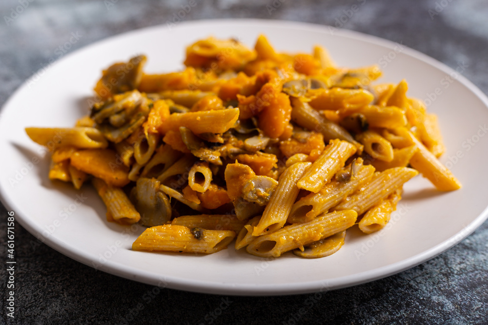 Pasta with pumpkin and mushrooms, a complete vegetarian dish. Ideal for an autumn lunch Pasta with pumpkin and mushrooms, a complete vegetarian dish. Ideal for an autumn lunch