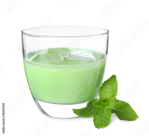 Delicious mint liqueur with ice cubes and fresh leaves isolated on white