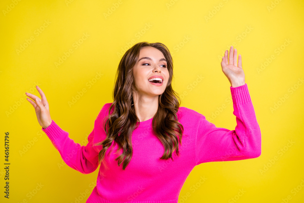 Photo of young attractive girl happy positive have fun look empty space isolated over yellow color background Photo of young attractive girl happy positive have fun look empty space isolated over yellow color background
