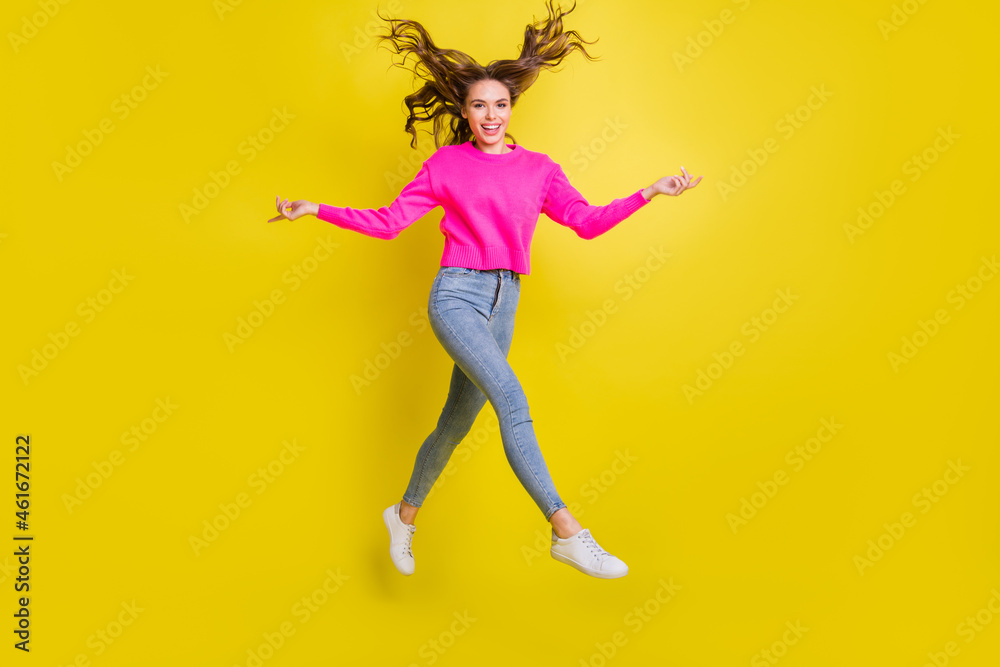 Full length profile size photo of young attractive girl happy positive smile go walk step jump isolated over yellow color background Full length profile size photo of young attractive girl happy positive smile go walk step jump isolated over yellow color background