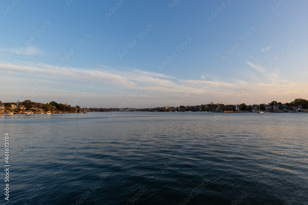 Coastline view of Parramatta River, Sydney, Australia with blue sky.