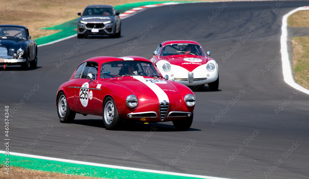 60s vintage race car competition on racetrack, Alfa Romeo Giulia TZ ...
