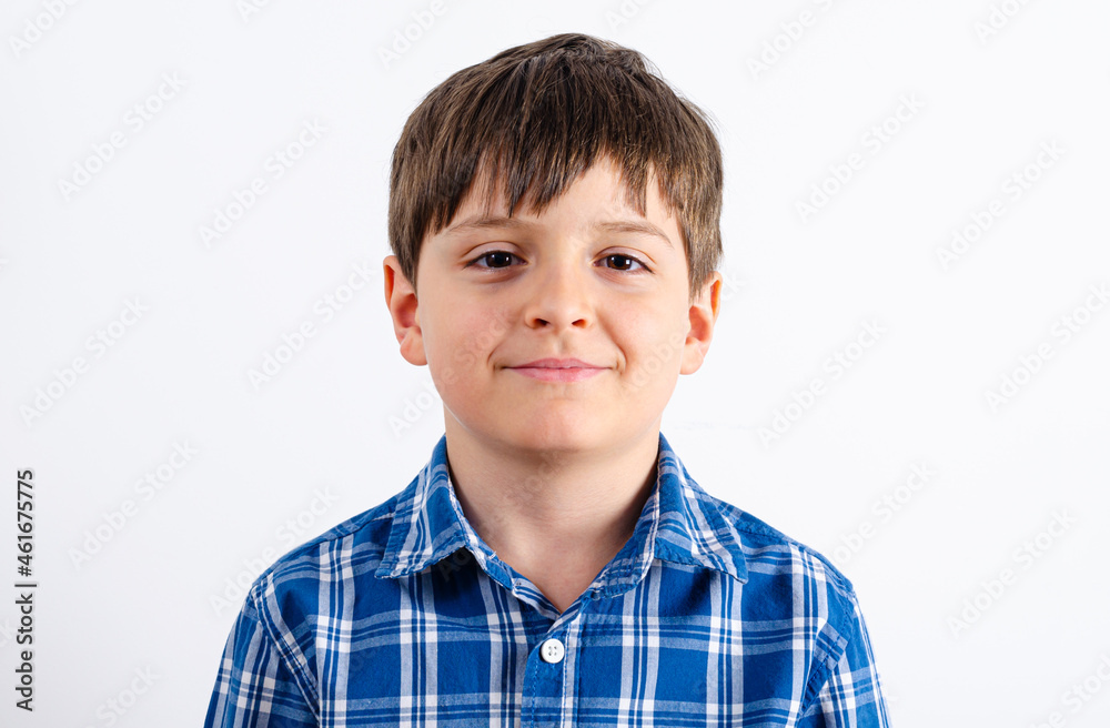 Cute boy wearing shirt looking at camera Cute boy wearing shirt looking at camera