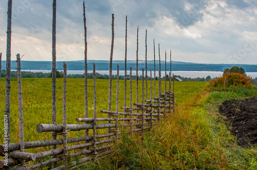 Fecne in front of Storsjön lake seen from village Ås in Jamtland, Sweden