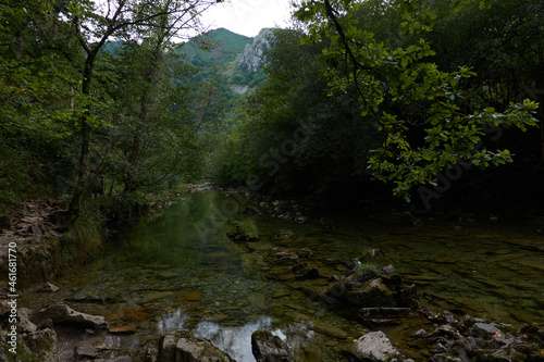 Fototapeta Naklejka Na Ścianę i Meble -  Senda De La Hoya De San Vicente across the Dobra River in the Ponga Natural Park in Asturias. Spain
