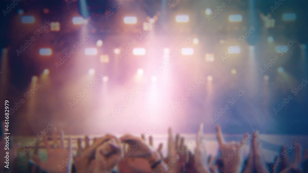 Concert Fans Cheering Hands Before Show, Stage Lights Flickering. Cheering crowd of people in a