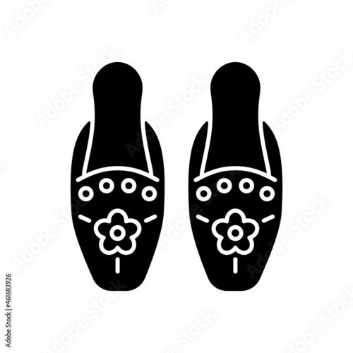 Traditional beadwork black glyph icon. Singaporean beaded slippers. National design. Decorating clothing. Peranakan embroidery. Silhouette symbol on white space. Vector isolated illustration