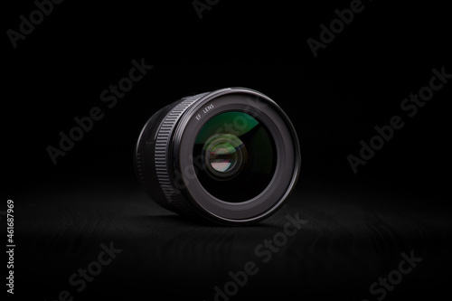Photography Photo Lens.  Ecstatic photo camera lens in a dark ambience