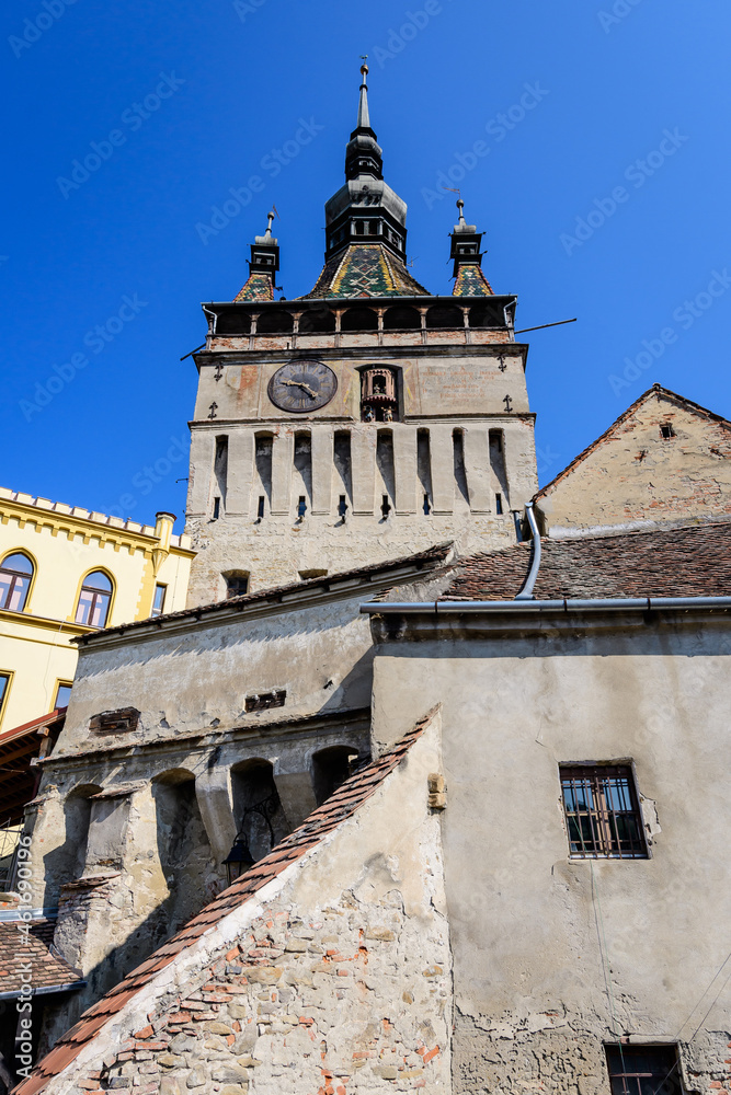 The The Clock Tower or the Council Tower of the medieval citadel in the old center of Sighisoara, a UNESCO World Heritage Site in Transylvania (Transilvania) region, Romania, in a sunny summer day.