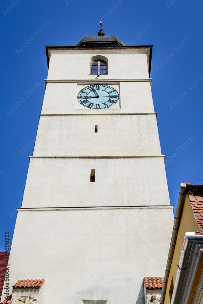 The Council Tower (Turnul Sfatului) towards clear blue sky  in the old city center of Sibiu, in Transylvania (Transilvania) region of Romania.