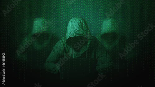 Hacker over a screen with binary code.Cyber Security concept.