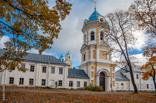 View of the bell tower and the temple of the Konevsky Nativity-Bogoroditsky Monastery on Lake Ladoga. photo