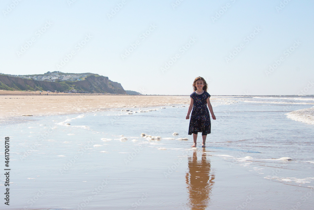 Young girl playing on. the Cromer beach in a sunny day of summer, joy, happiness, holiday, vacation in England, United Kingdom, Norfolk coast, North sea
Young girl playing on. the Cromer beach in a sunny day of summer, joy, happiness, holiday, vacation in England, United Kingdom, Norfolk coast, North sea