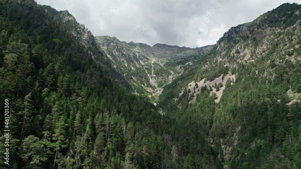 The view of the menacing harsh mountains, the weather looks like a storm. The flight at the height of the peaks shows the power of nature. The view of the menacing harsh mountains, the weather looks like a storm. The flight at the height of the peaks shows the power of nature.