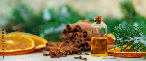 Fototapeta Naklejka Na Ścianę i Meble -  Christmas essential oils in small bottles. Selective focus.