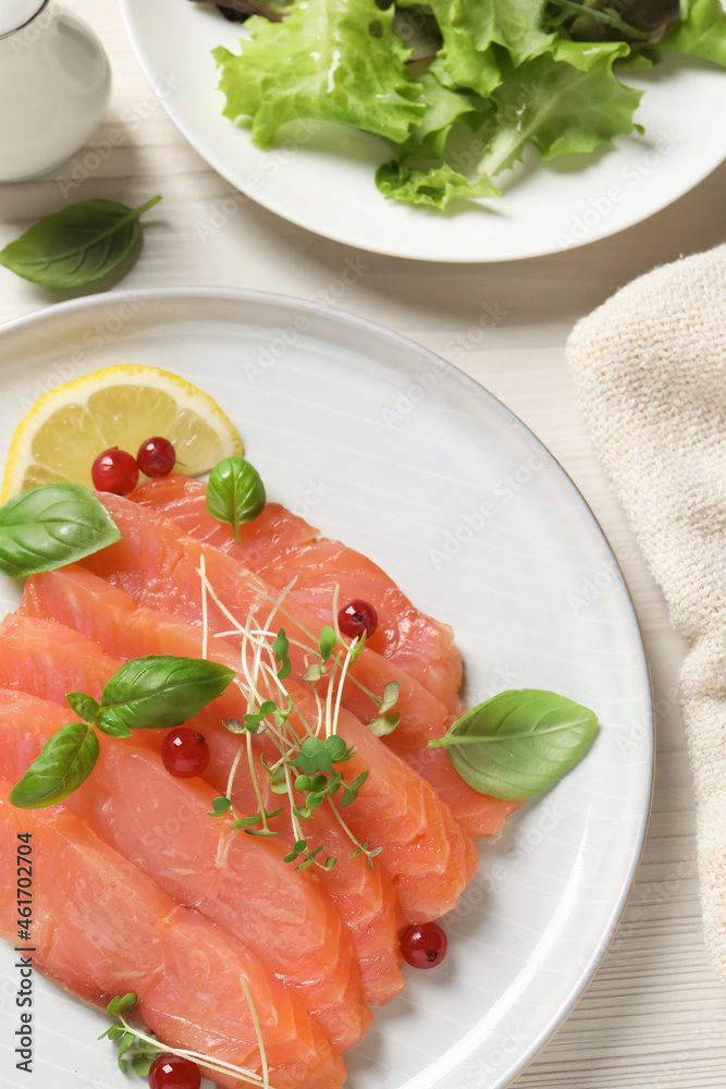 Delicious salmon carpaccio served on white wooden table, flat lay