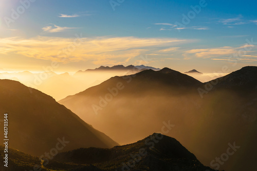 mountain landscape with haze at sunset. Mountain ranges of 