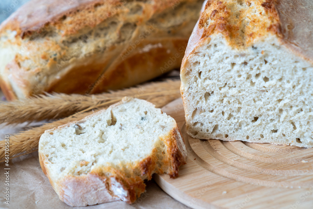 Freshly home baked sliced bread on a wooden board. Freshly home baked sliced bread on a wooden board.