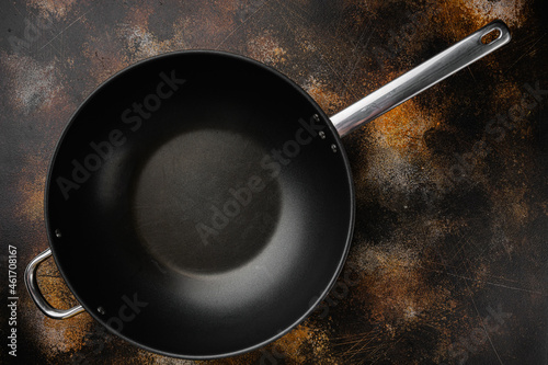 Empty Wok skillet with copy space for text or food with copy space for text or food, top view flat lay , on old dark rustic table background