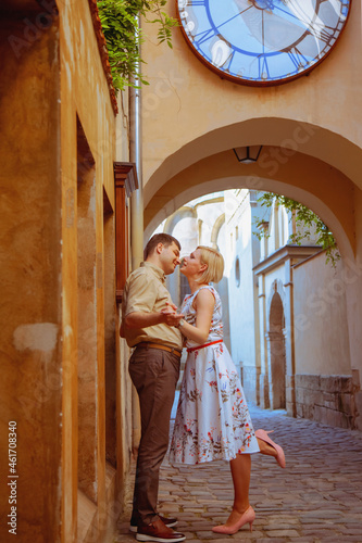Lovely happy couple. Romantic portrait of married couple in love. The people are kissing as a symbol of tenderness and love. © zwiebackesser