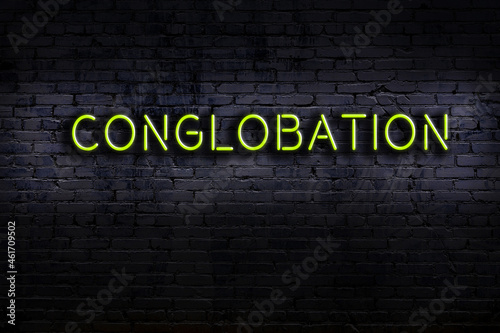 Neon sign. Word conglobation against brick wall. Night view photo