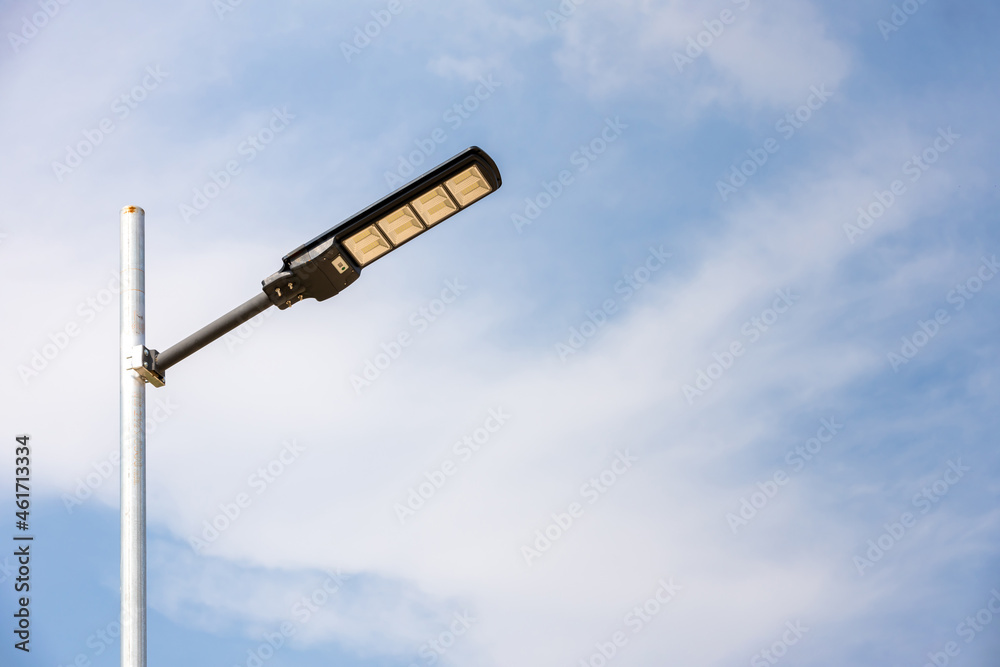 A modern street LED lighting pole. Urban electro-energy technologies. Poles on the road with LED light. Outdoor lighting strong LED lamp. A modern street LED lighting pole. Urban electro-energy technologies. Poles on the road with LED light. Outdoor lighting strong LED lamp.