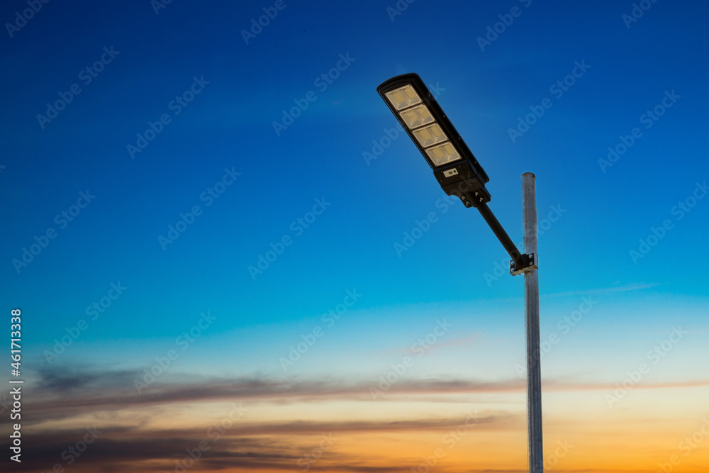 A modern street LED lighting pole. Urban electro-energy technologies. Poles on the road with LED light. Outdoor lighting strong LED lamp. A modern street LED lighting pole. Urban electro-energy technologies. Poles on the road with LED light. Outdoor lighting strong LED lamp.