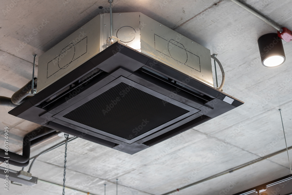 air conditioning hanging from ceiling. cassette type air conditioner.  Stock-foto | Adobe Stock