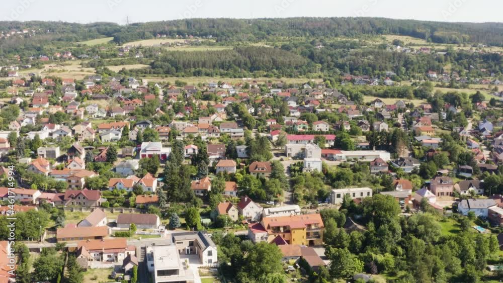 Aerial drone shot - colorful houses in a beautiful town in a rural area - drone turns to the left Aerial drone shot - colorful houses in a beautiful town in a rural area - drone turns to the left