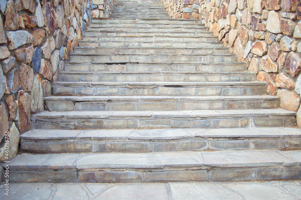 wide staircase in the park, lined with finishing stone. Stone stairs up wide staircase in the park, lined with finishing stone. Stone stairs up