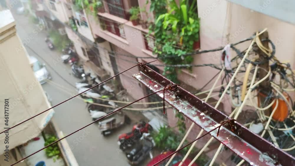 Close-up of electricity pylon during heavy rain in New Delhi, India