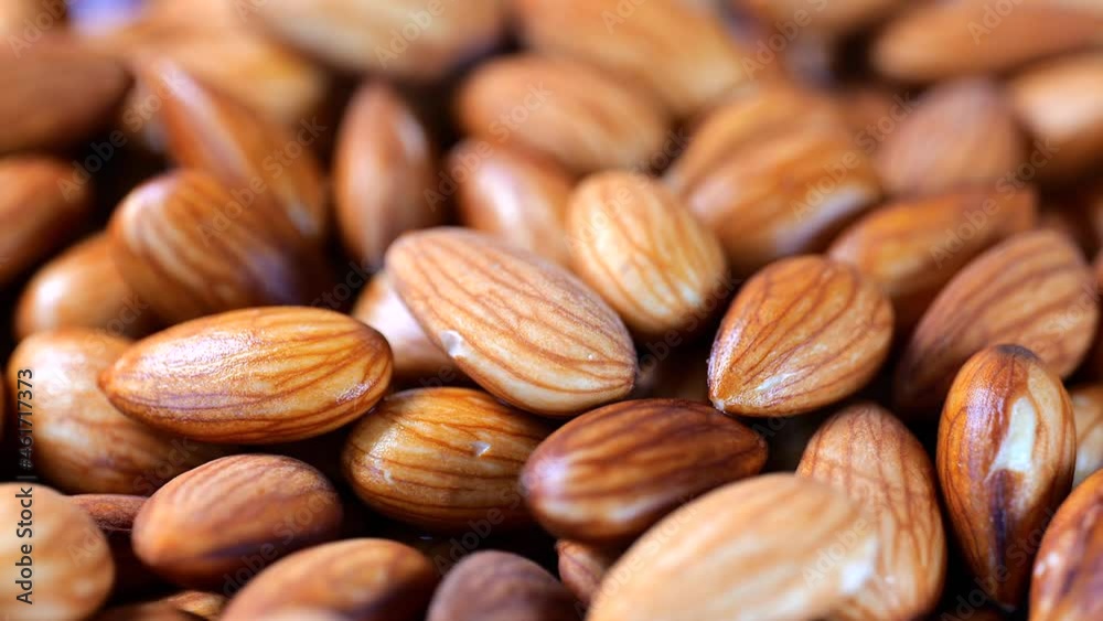 Closeup of rotating soaked almond nuts healthy food Closeup of rotating soaked almond nuts healthy food