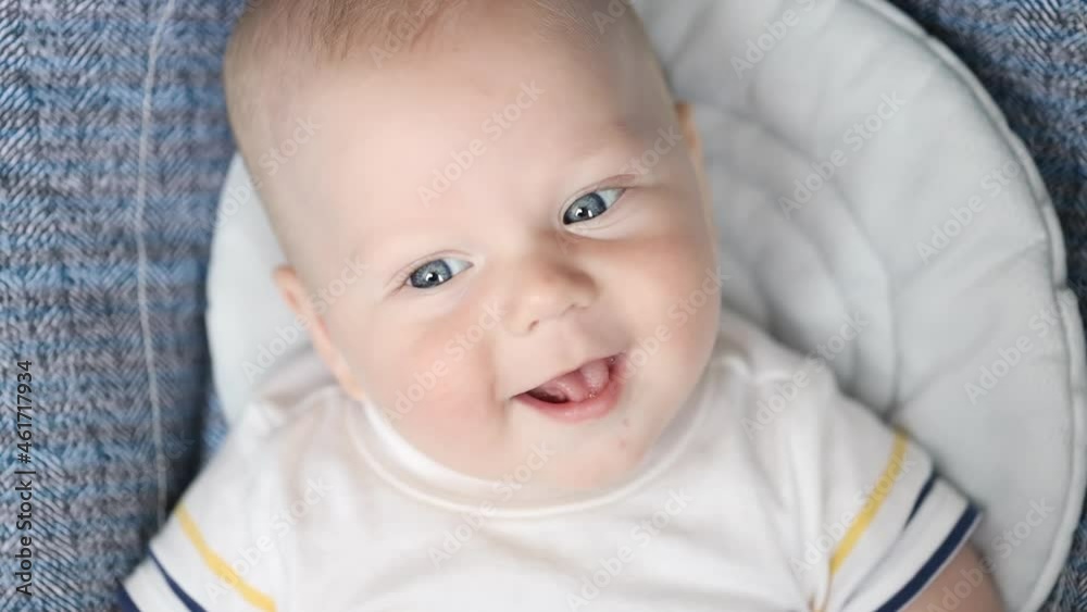 Happy toothless smile of adorable newborn baby, close up portrait Happy toothless smile of adorable newborn baby, close up portrait