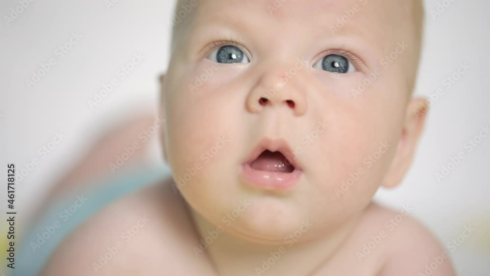 Happy toothless smile of adorable newborn baby, close up portrait. Funny face Happy toothless smile of adorable newborn baby, close up portrait. Funny face