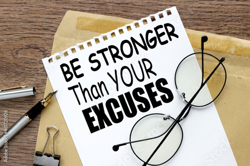 Be Stronger Than Your Excuses, Envelope, ink pen, wood background.